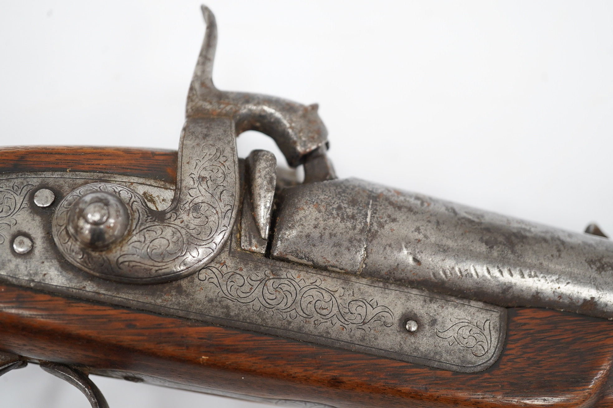 A Turkish flintlock Kubar pistol, with fully stocked brass mounts, polished steel lock and barrel (well worn), barrel 31cm, and a double barrel 12 bore percussion pistol cut down from a sporting gun, barrel 26.5cm, (2).